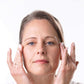 Woman Applying  Anti-Aging Eye Cream